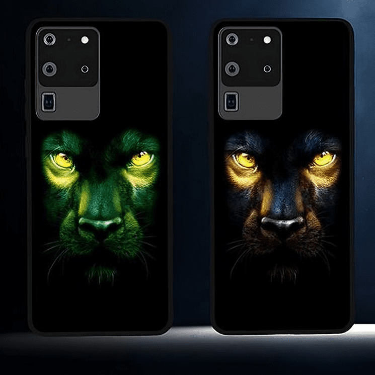 Two phone cases with glowing panther faces in green and yellow hues.